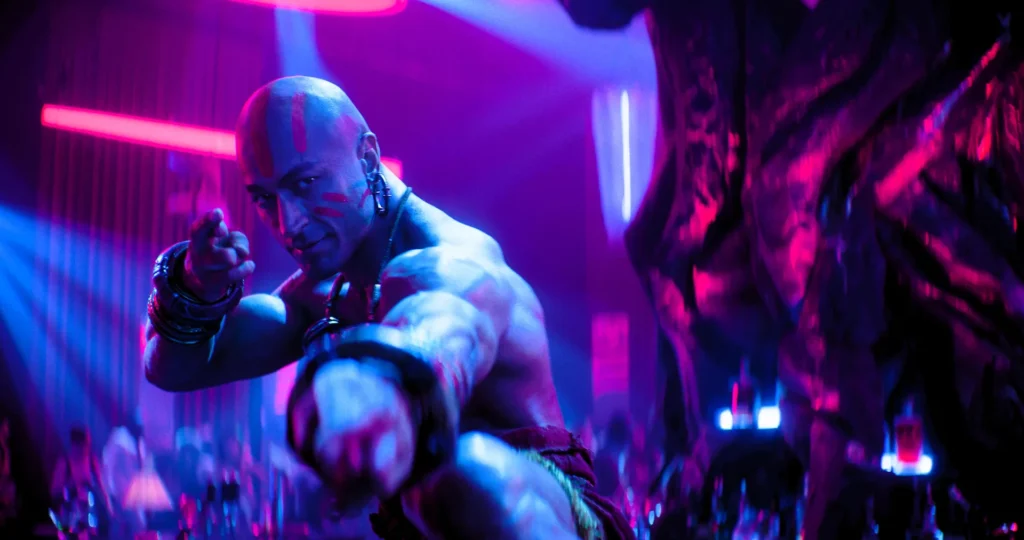 Vidyut Jammwal as Dhalsim pointing at camera in a neon nightclub scene from Street Fighter 2026